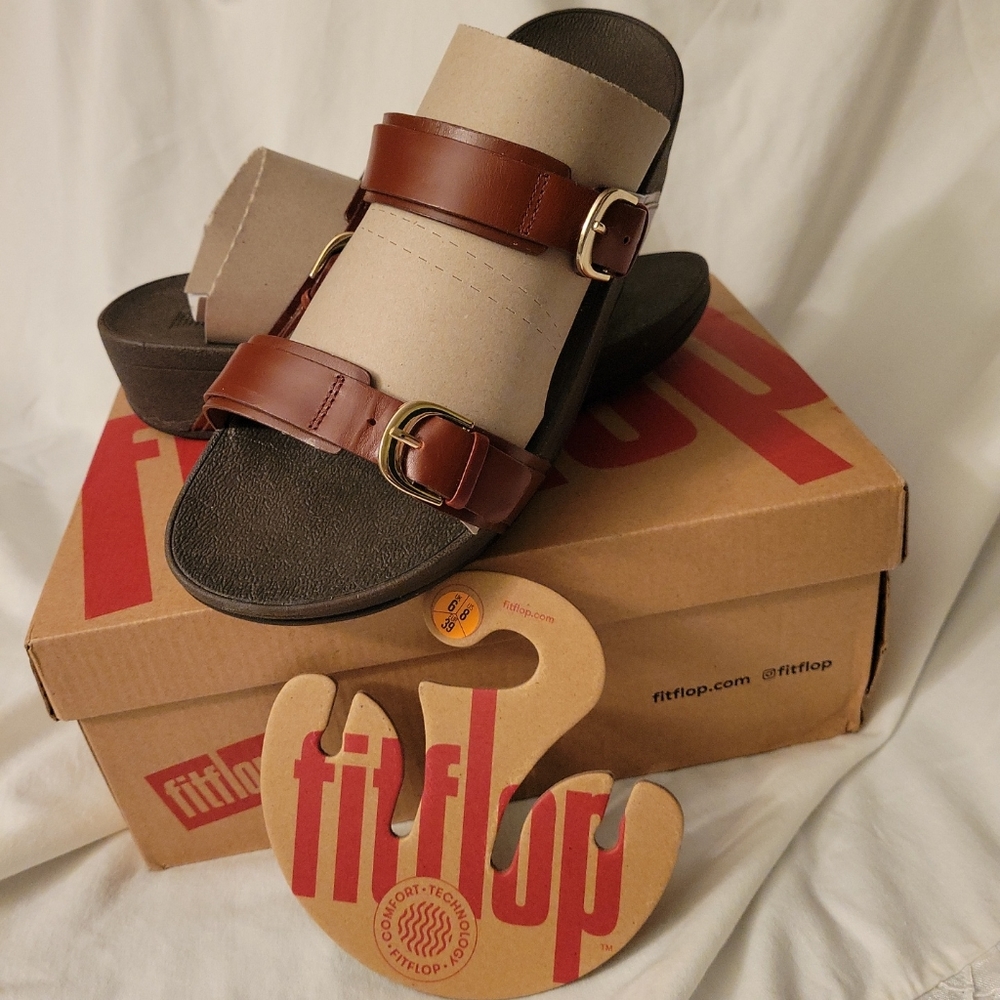 New In the box, Fit Flop Sandals Size 8. Beautiful cognac, adjustable buckle.